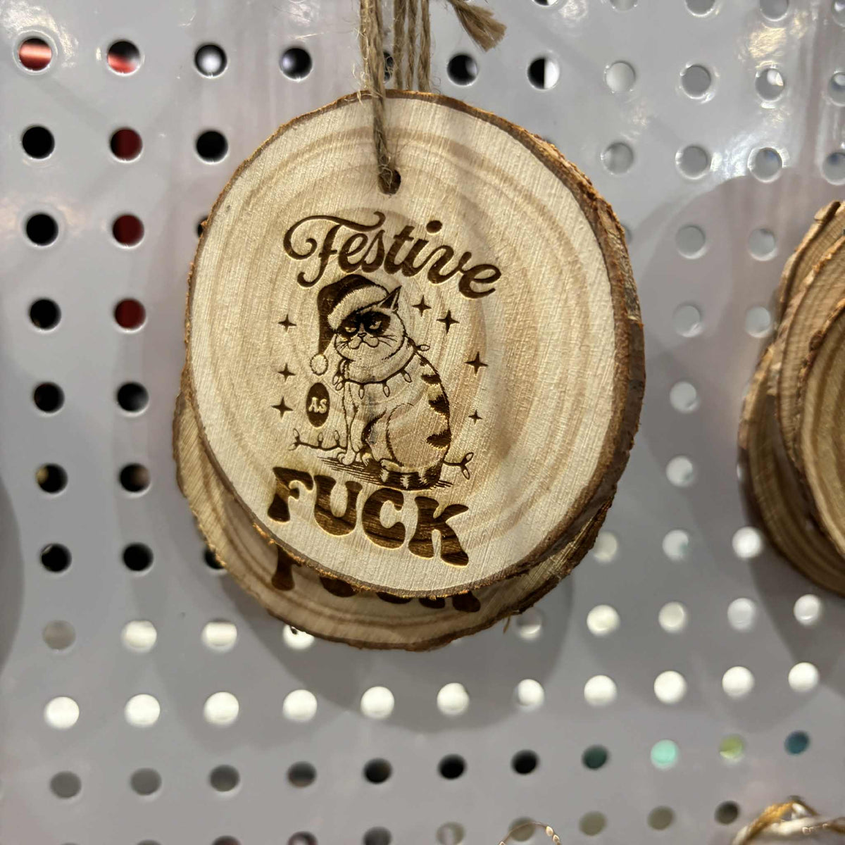 Wood slice Christmas ornament with "Festive as Fuck" laser-engraved design